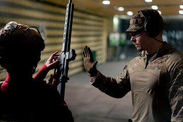 At a professional shooting range military trainer teaches a cheap girl how to hold a NATO rifle...