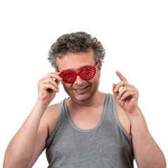 Gray-haired, shaggy, unshaven middle-aged man in a sleeveless T-shirt wearing sunglasses in the...
