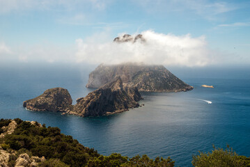 Magical view Es Vedra island covered in misty clouds, Sant Josep de Sa Talaia, Ibiza, Balearic Islands, Spain
