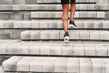 Athlete, legs and running up stairs in city for fitness, workout and exercise in summer. Runner,...
