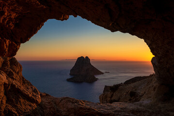Es Vedra island sunset view from the Eye of Es Vedra cave, Sant Josep de Sa Talaia, Ibiza, Balearic Islands, Spain
