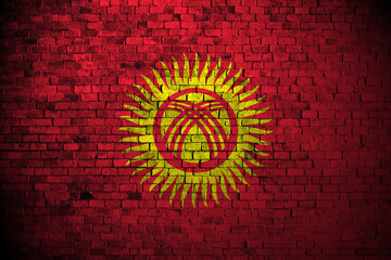kyrgyzstan flag on brick wall - obrazy, fototapety, plakaty