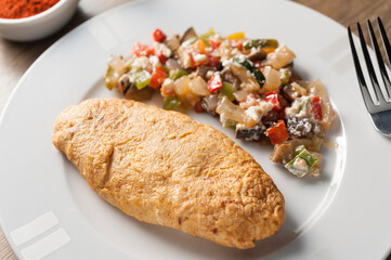 french omelette with sauteed vegetables overhead view
