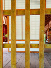 Detail shot of a wooden curtain wall of a pavilion in the Japanese garden of Toulouse