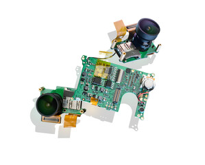 A small sports camera, taken apart. Two wide-angle lenses and a printed electronic board. Handheld...