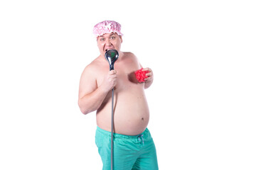 Good morning. Funny fat man washes in the shower and sings. The guy poses in the studio on a white background. Fun and joy.