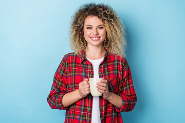 Photo of dreamy relaxed lady enjoy cacao pause toothy smile wear checkered shirt isolated blue...