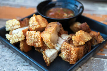 Crispy pork belly with sweet and sour sauce.