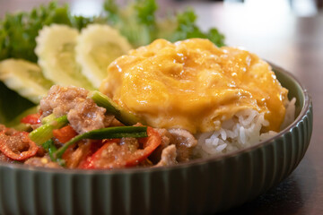 Stir-fried pork with shrimp paste and served with rice and a fried egg.