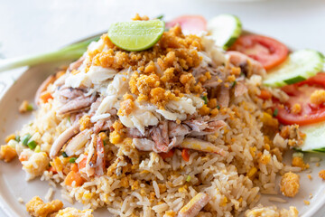 Fried rice with crab on white plate.