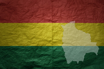 big national flag and map of bolivia on a grunge old paper texture background