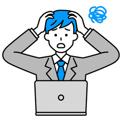 困惑しているノートパソコンとスーツの男性