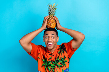 Photo of funky dreamy guy dressed print shirt holding head pineapple looking emtpy space isolated...