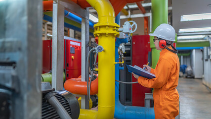 Maintenance technician at a heating plant,Petrochemical workers supervise the operation of gas and...