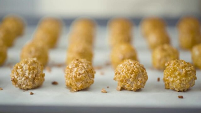 Preparation of panellets a traditional Spanish and Catalan sweets for All Saints Day and Halloween