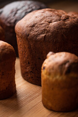Freshly Baked Big and Small bread rolls on Wooden Surface