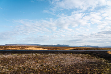 Icelandic panoramas, wide plains with mountains in the distance. Colours, volcanic lands, northern valleys.