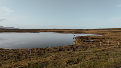 Icelandic panoramas, wide plains with mountains in the distance. Colours, volcanic lands, northern valleys.