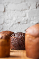 Freshly Baked slightly burnt Bread Rolls on white textured wall