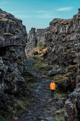 Almannagja fault, long rocky gorge in Iceland. Golden Circle, Þingvellir Park, walk along the canyon between two tectonic plates.