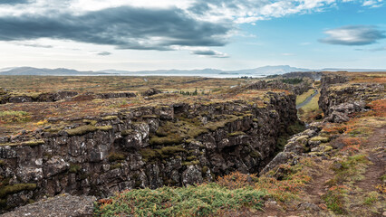 Almannagja fault, long rocky gorge in Iceland. Golden Circle, Þingvellir Park, walk along the...