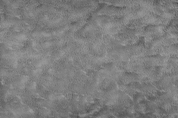 Texture of fluffy gray upholstery fabric or cloth. Fabric texture of artificial fur textile material. Canvas background. Decorative fabric for curtain, furniture, walls, clothes.
