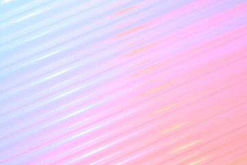 Soft pink and purple streaks blend across a plastic surface, creating a tranquil, abstract...