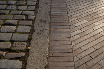 The pavement area is paved with gray large stones and tiles texture