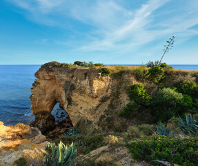 Summer Atlantic ocean coast view with rock formations (Porches, Lagoa, Algarve, Portugal).