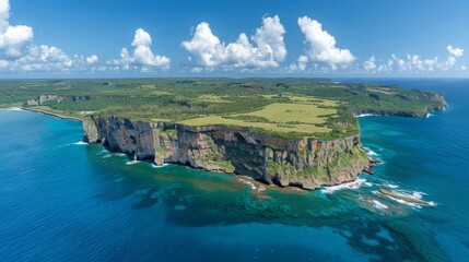   An aerial perspective of an island situated in the vast expanse of a body of water located in the heart of the ocean