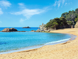 Mediterranean sea rocky coast summer view with sandy beach (Costa Brava, Catalonia, Spain).