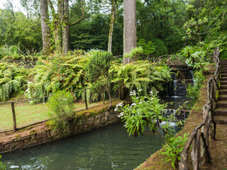 Water cascade and steps at Parque das Queimadas, the starting point of Levada Caldeirao Verde and Caldeirao do Inferno hiking trails