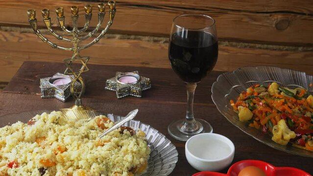 The Pesach Seder table is festively set with matzo candles and wine. General plan