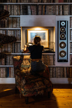 Vinyl lover enjoying music in cozy room
