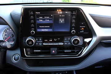 Screen multimedia system on dashboard in a modern SUV. Touch multimedia system on screen car. Panel of a modern car. 