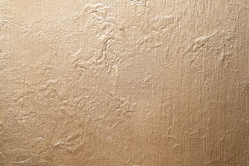 Golden abstract texture on canvas, background