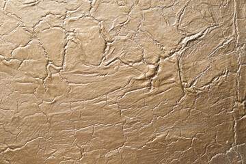 Golden abstract texture on canvas, background