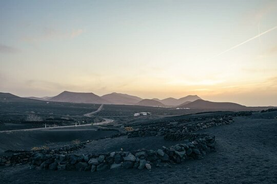 sunset over the volcanoes near the road
