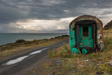 Abandoned train wreck on the shores of Lake Sevan. Gavar, Armenia.