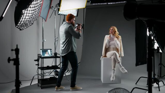 Photographer and fashion model in studio for creative art, clothes brand and designer social media blog