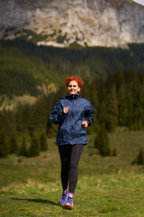 Woman trail runner in the mountains - 808263925