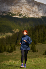 Woman trail runner in the mountains - 808263927