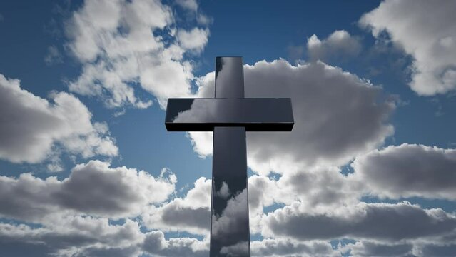 A large Christian cross against the backdrop of fast clouds. Religion, faith, freedom.
