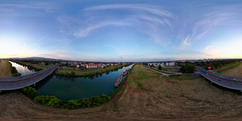 Aerial 360 panorama of Zagreb city Youth Bridge and heating plant with abandoned cargo ships...