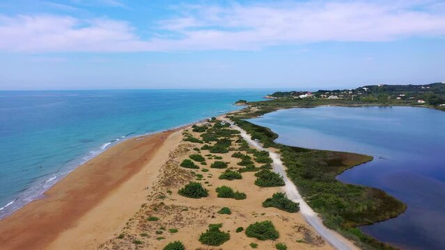 Aerial drone view of Halikounas Beach and Lake Korission, Corfu island, Ionian Sea, Greece. Halikounas Beach, Corfu Island. View of the deserted, sandy, windy beach on the western part of Corfu.