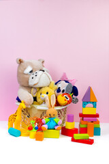 Collection of colorful toys on pink background. Kids toys.