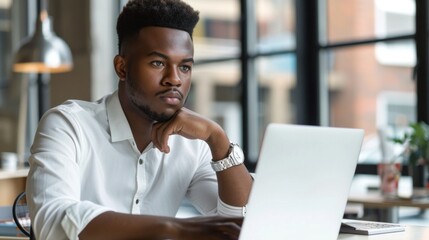 Naklejka premium Businessman using laptop computer in office. Happy middle aged man, entrepreneur, small business owner working online.