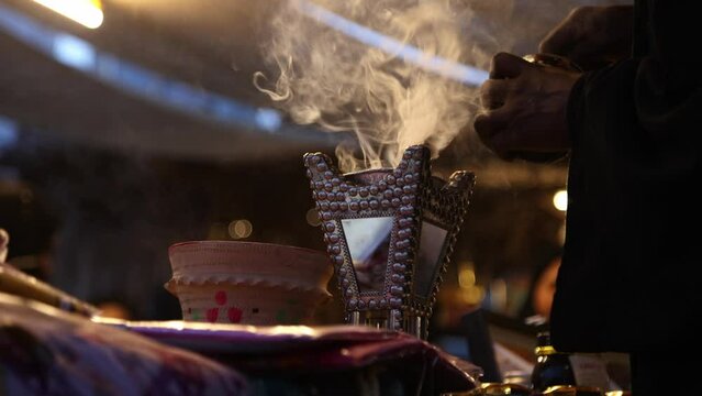 Traditional Arabic incense bukhoor agar wood burner with smoke