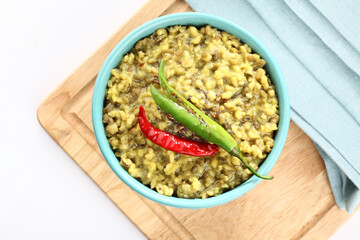 Mung Dhal or lentil curry. Moong Dal - Indian Cuisine curry. Mung bean Tadka ,Vegetarian dish with mung beans, zira cumin, coriander and chili tadka