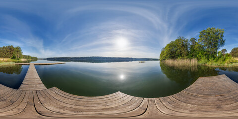 full seamless spherical hdri 360 panorama on wooden pier of lake or river in morning or sunset in...